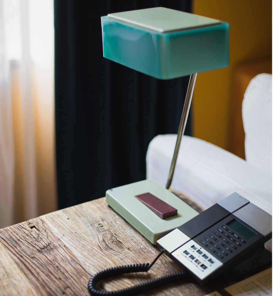 stamba hotel aviator suite room vintage desk lamp and telephone