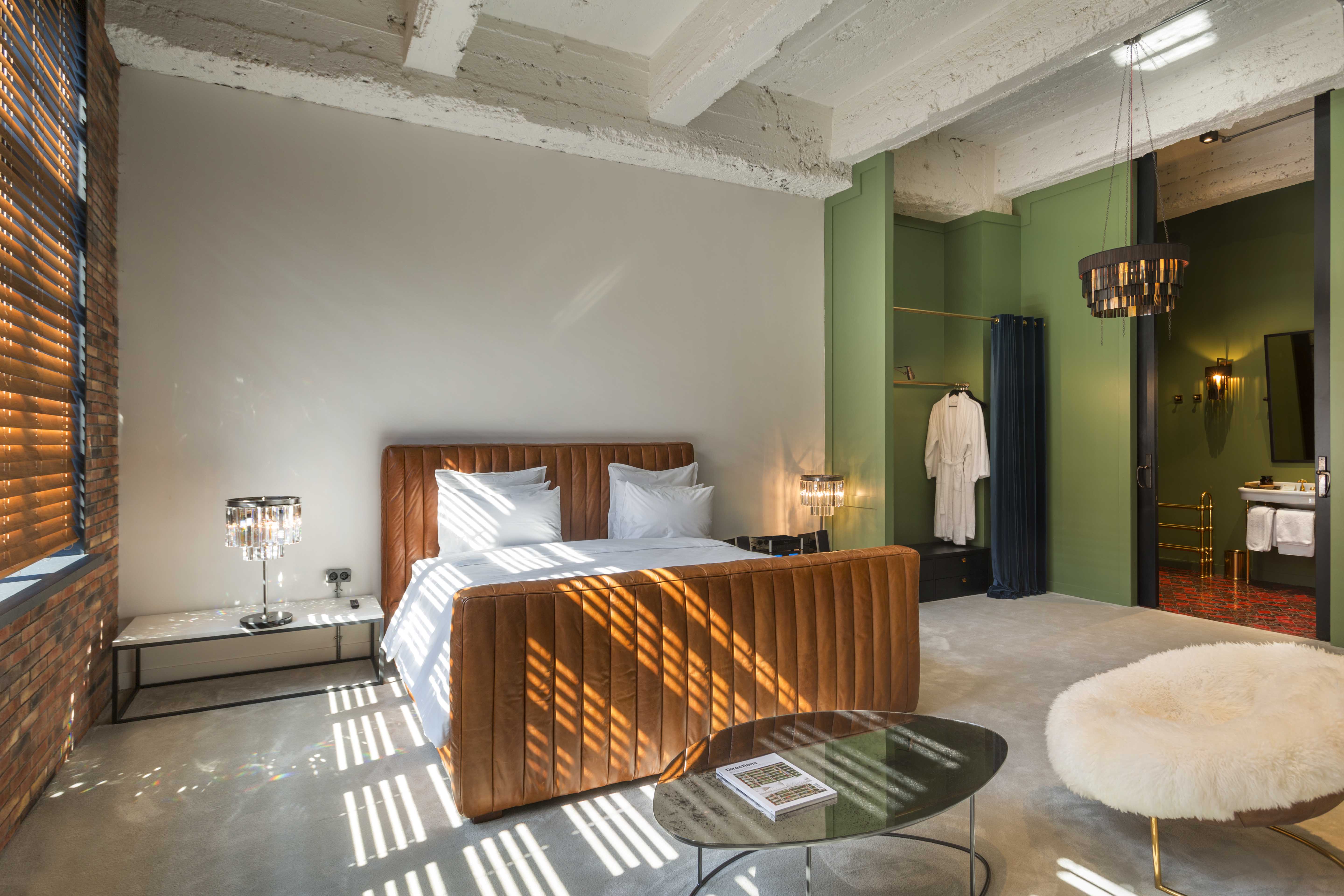 stamba hotel aviator room bed and bathroom