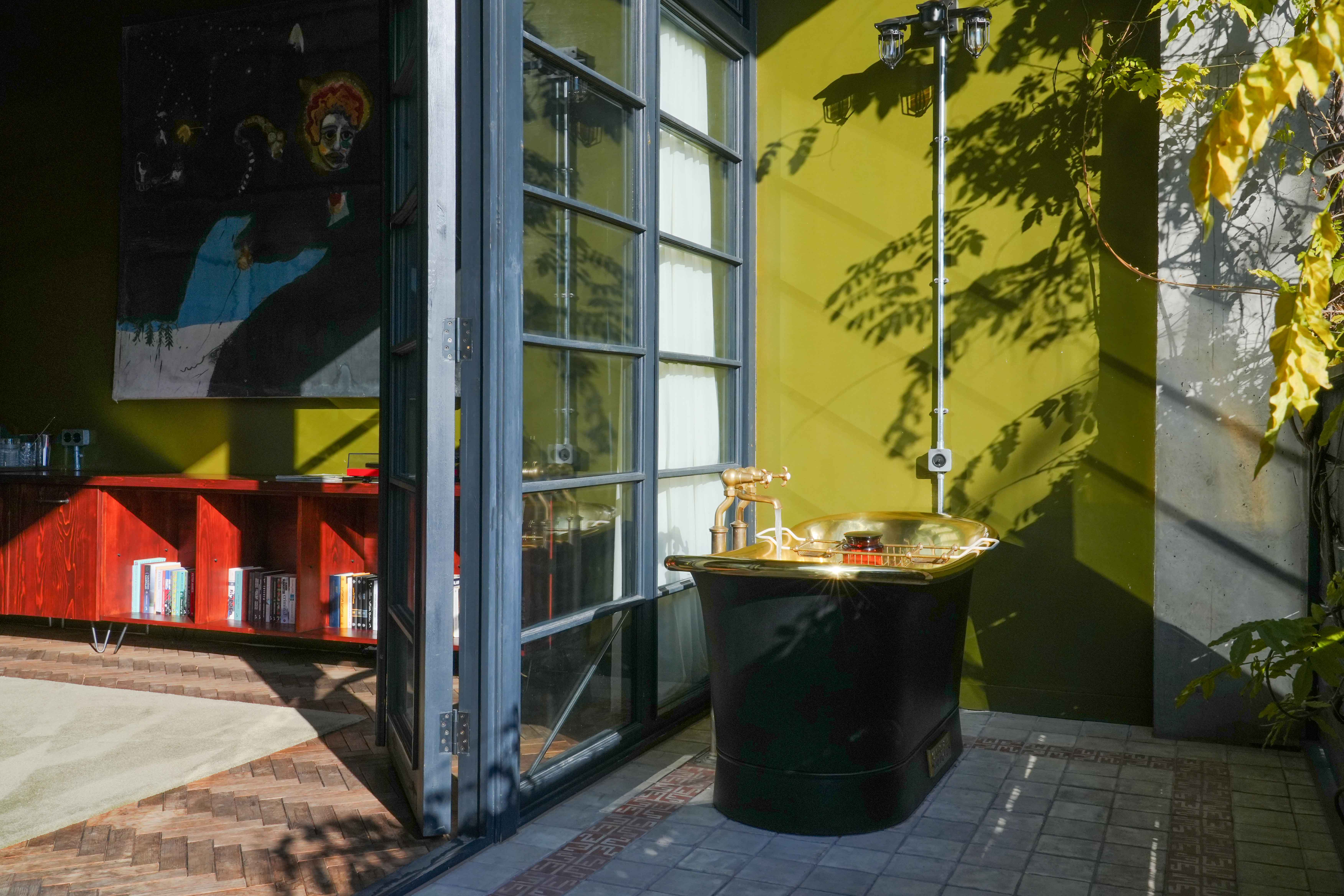 stamba hotel signiture terrace room balcony with wide window and decorative godlen bathtub