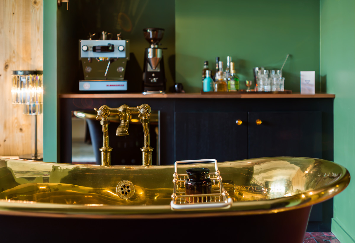 stamba hotel aviator signature room with golden bathtub