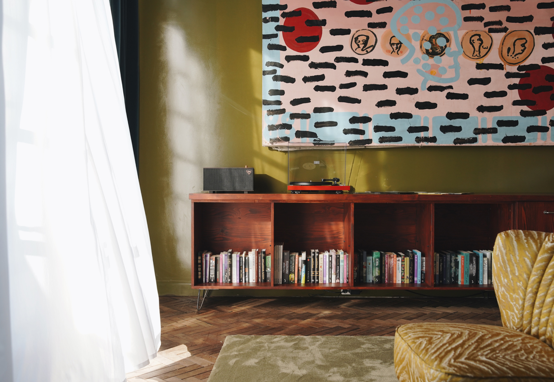 bookshelves and other decorations at stamba hotel terrace room